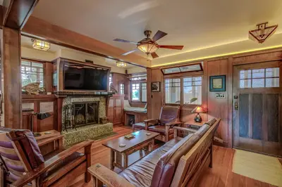 a living room with a couch and a fireplace at The Craftsman Coastal Cottage in Leucadia in Encinitas