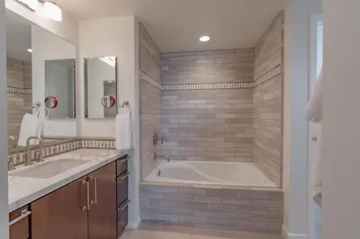 a large bathroom with two sinks and a tub at Beachside Paradise in Windansea in San Diego
