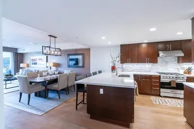 a large kitchen and dining room with a dining table and chairs at Beachside Paradise in Windansea in San Diego