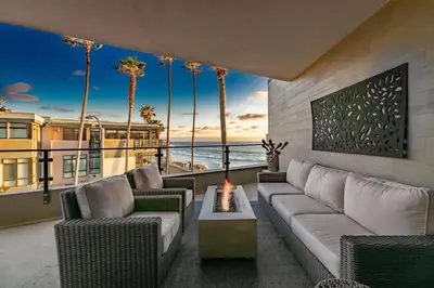 a living room with couches and a view of the ocean at Beachside Paradise in Windansea in San Diego