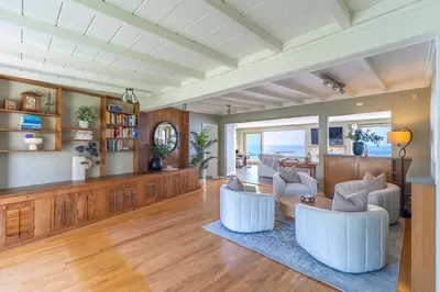 a large living room with white chairs and a table at Perched Ocean Paradise in San Diego