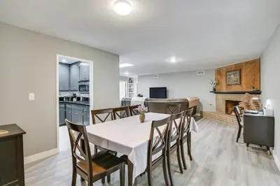 a dining room and kitchen with a table and chairs at Fireplace, Hot Tub, Patio and BBQ San Diego Home in Spring Valley