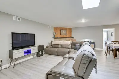 a living room with a couch and a flat screen tv at Fireplace, Hot Tub, Patio and BBQ San Diego Home in Spring Valley