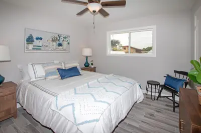 a bedroom with a bed and a ceiling fan at Fallbrook's Finest Hideaway in Fallbrook