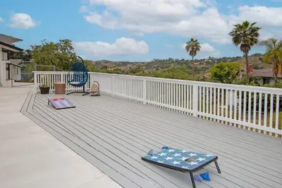 a deck with two chairs and a table on it at Fallbrook's Finest Hideaway in Fallbrook