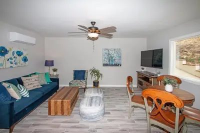 a living room with a couch and a table at Fallbrook's Finest Hideaway in Fallbrook