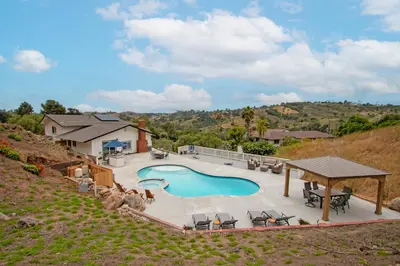 an aerial view of a swimming pool in a backyard at Fallbrook's Finest Hideaway in Fallbrook