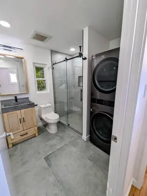 a bathroom with a shower and a toilet and a sink at La Jolla Retreat in San Diego