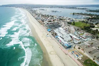an aerial view of a beach with a roller coaster at Ocean Front, Steps Mission Beach, Bay, Remodeled, Mission Beach Jamaica FLAT in San Diego