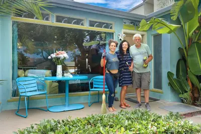 a man and a woman standing in front of a house at Ocean Front, Steps Mission Beach, Bay, Remodeled, Mission Beach Jamaica FLAT in San Diego