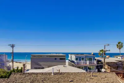 a view of a beach with buildings and the ocean at Massive Beach Home with Ocean View & Amazing Rooftop in San Diego
