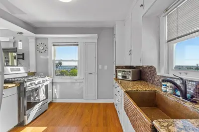 a kitchen with a sink and a counter top at Bankers Hill Hideaway with AC Views and Parking in San Diego