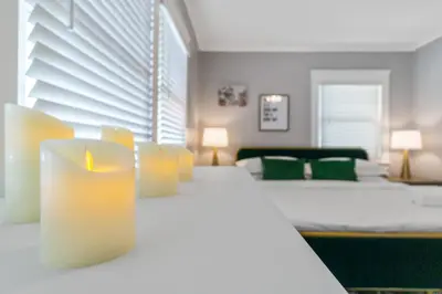 a bedroom with two beds and a candle on a table at Bankers Hill Hideaway with AC Views and Parking in San Diego