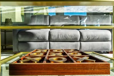a box of donuts on a table in front of a couch at Bankers Hill Hideaway with AC Views and Parking in San Diego