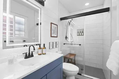 a bathroom with a sink and a toilet and a shower at Oceanside Oasis - King Bed, Pet Friendly, Fire Pit in Oceanside
