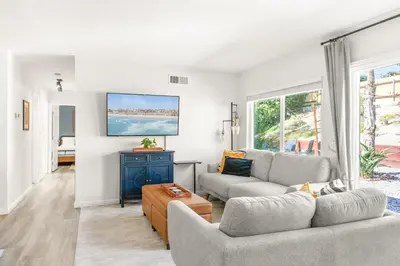 a living room with two couches and a tv at Oceanside Oasis - King Bed, Pet Friendly, Fire Pit in Oceanside