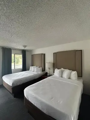a hotel room with two beds and a window at Back Country Inn in Boulevard