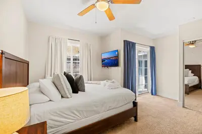 a bedroom with a bed with a ceiling fan at Luxury on Lewis By Cardo - Jacuzzi Fire Pit in San Diego
