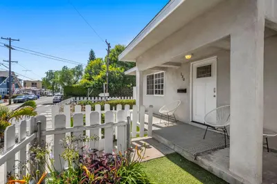 a white fence in front of a house at Luxury on Lewis By Cardo - Jacuzzi Fire Pit in San Diego