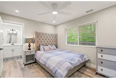 a bedroom with a bed and a ceiling fan at Hidden Oasis Near Safari - Wineries - Lakes in Escondido