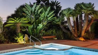 a swimming pool with palm trees and a bunch of sidx sidx sidx at Rancho Real by AvantStay Private Pool Hot Tub Luxe Group Retreat in Rancho Santa Fe