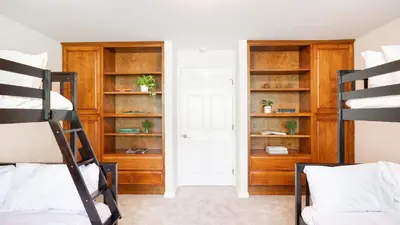 a bedroom with two bunk beds and a closet at Rancho Real by AvantStay Private Pool Hot Tub Luxe Group Retreat in Rancho Santa Fe