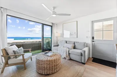 a living room with a view of the ocean at Luxury Ground N Oceanfront Unit with Patio Lounge in San Diego