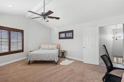 a bedroom with a bed and a ceiling fan at Peaceful Getaway with Renovated Amenities in San Diego