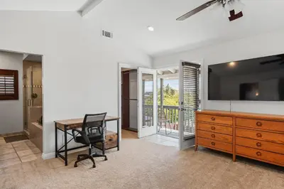 a home office with a desk and a television at Peaceful Getaway with Renovated Amenities in San Diego