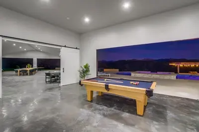 a living room with a pool table in it at Serene Resort-Style Escape - Perfect for Families in El Cajon
