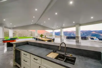 a kitchen with a sink and a view of the mountains at Serene Resort-Style Escape - Perfect for Families in El Cajon
