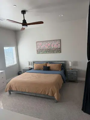 a bedroom with a bed and a ceiling fan at Serene Resort-Style Escape - Perfect for Families in El Cajon