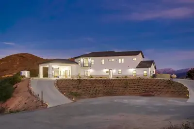 a large white house on a hill with a driveway at Serene Resort-Style Escape - Perfect for Families in El Cajon
