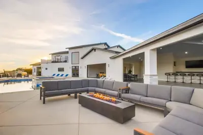 a living room with a couch and a fire pit at Serene Resort-Style Escape - Perfect for Families in El Cajon