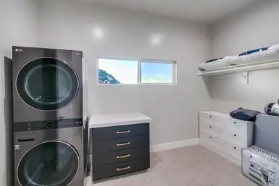 a laundry room with two washer and dryer at Serene Resort-Style Escape - Perfect for Families in El Cajon