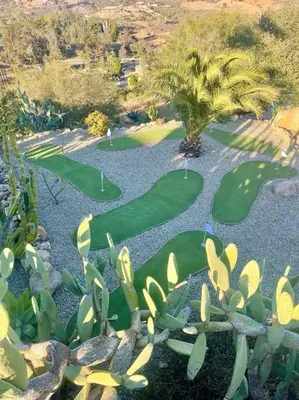 an overhead view of a golf course with golf greens at Gorgeous Private Estate with Pool & Pickleball Court in Lakeside