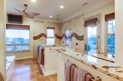 a bathroom with a sink and a large mirror at Gorgeous Private Estate with Pool & Pickleball Court in Lakeside