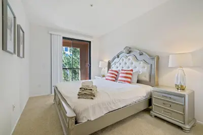 a white bedroom with a bed and a window at 3 Bedrooms Apt with Pool ,GYM in Irvine