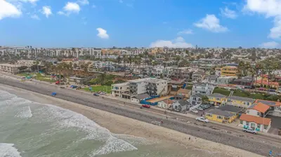 an aerial view of a beach with houses and condos at The Shining Sea B in Oceanside