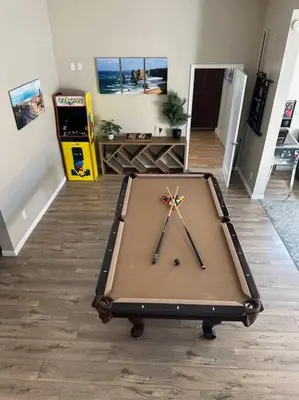 a pool table in the middle of a room at Large Pool Home on Two Acres with Views! in Vista