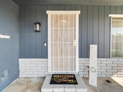 a door with a welcome sign in front of a house at Super Spacious Family Vacation House! in San Diego
