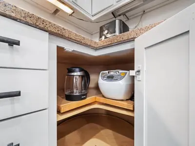 a kitchen with a pantry with a appliance in it at Super Spacious Family Vacation House! in San Diego