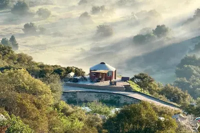 a house on top of a hill with a pool at Mystical Mongolian Yurt in Fallbrook with Views! in Temecula