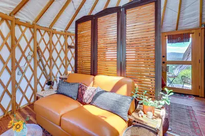 a living room with a couch in a yurt at Mystical Mongolian Yurt in Fallbrook with Views! in Temecula