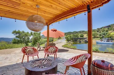 a patio with chairs and a table with a view of a river at Mystical Mongolian Yurt in Fallbrook with Views! in Temecula