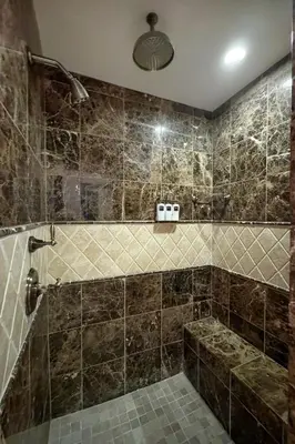 a tiled bathroom with a shower and a tub at Heated Pool & Hot Tub Access, Walk 2 Omni Resort, Free Parking, Wi-Fi, Washer & Dryer in Encinitas