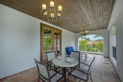 a dining room with a table and chairs and a chandelier at Heated Pool & Hot Tub Access, Walk 2 Omni Resort, Free Parking, Wi-Fi, Washer & Dryer in Encinitas