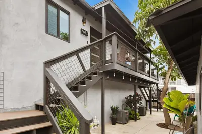 a staircase leading up to a house with plants at Modern 1 BR Apt - Walk to Ocean & Cafes in San Diego