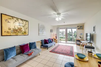 a living room with a couch and a table at Condo Near Hospitals and half Mi to Mission Bay! in San Diego