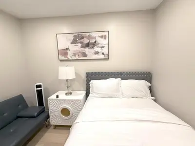 a bedroom with a bed and a couch at Exotic Homes Gillespie Dr by SD stay in Spring Valley